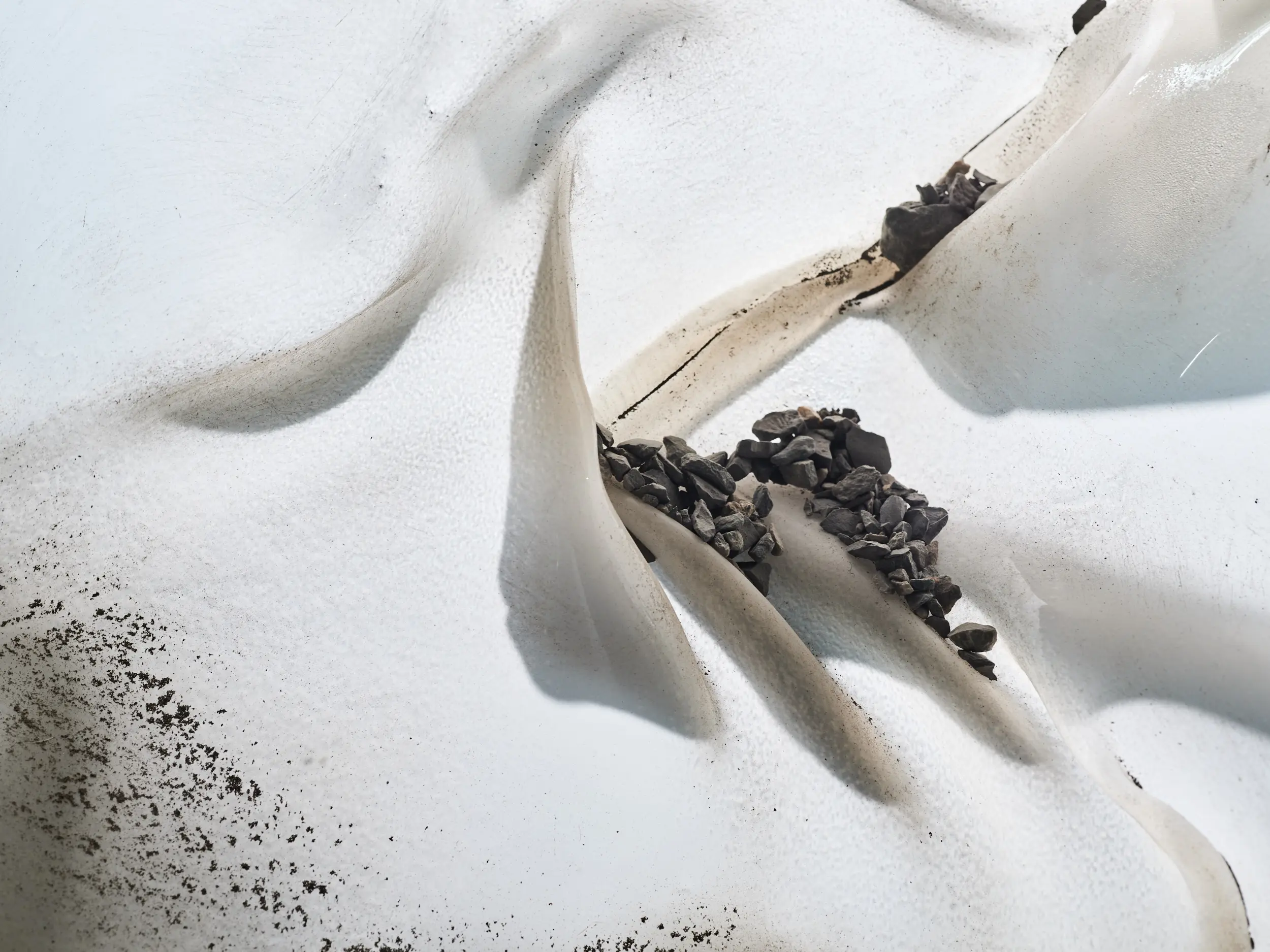 Detail from one of the Im Griess sound machines, showing rocks on small ledges on ice.